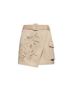 Cotton miniskirt with pierced embroidery and cargo pockets