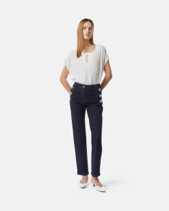 Dark denim jeans with jewel buttons