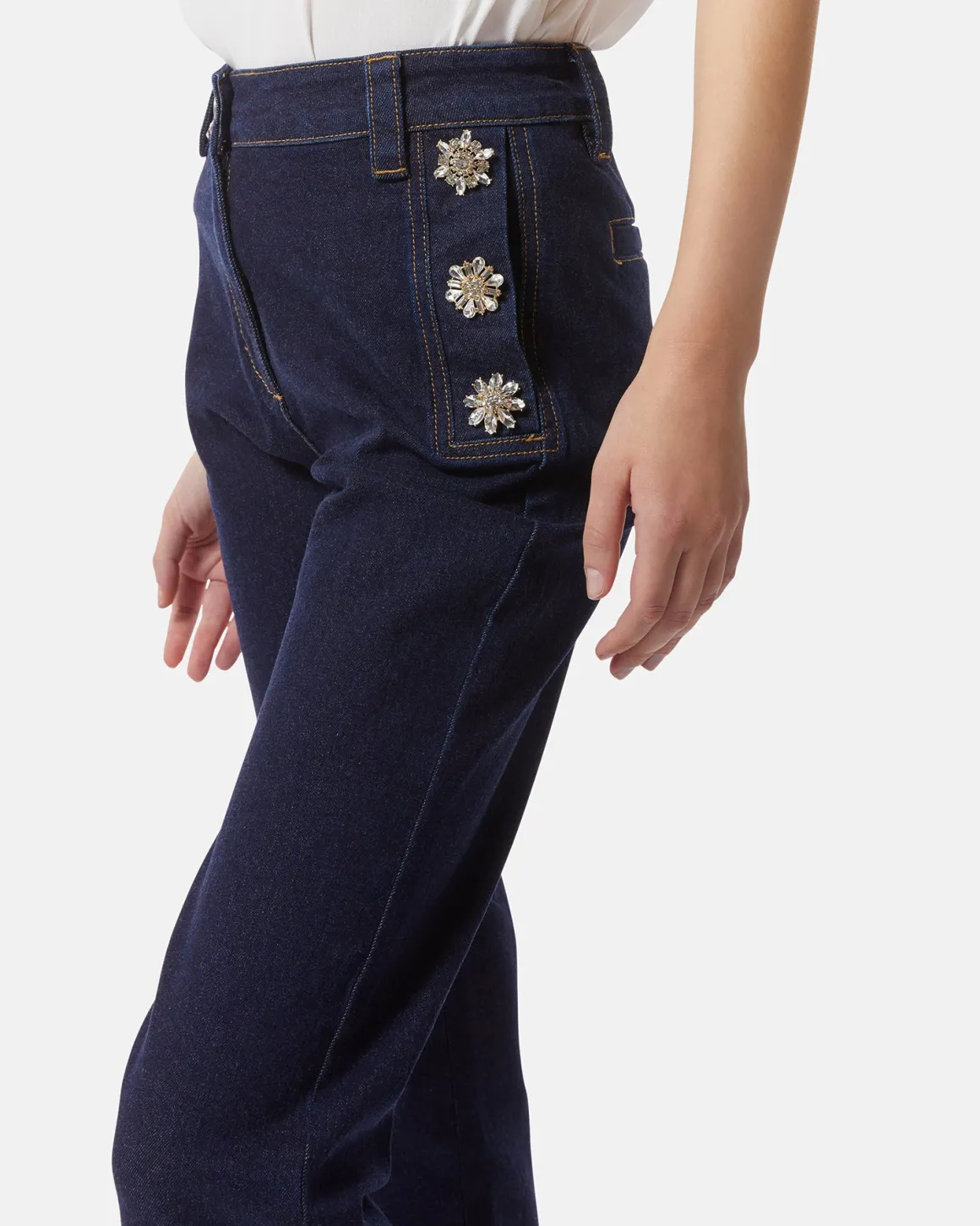 Dark denim jeans with jewel buttons