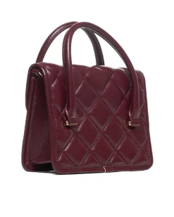 Quilted bag with handle and chain