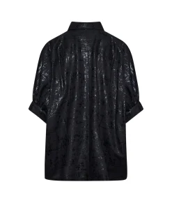 Shirt with luminous effect surface