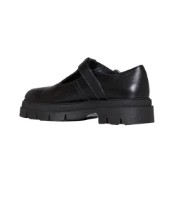 Shoe with strap and structured sole