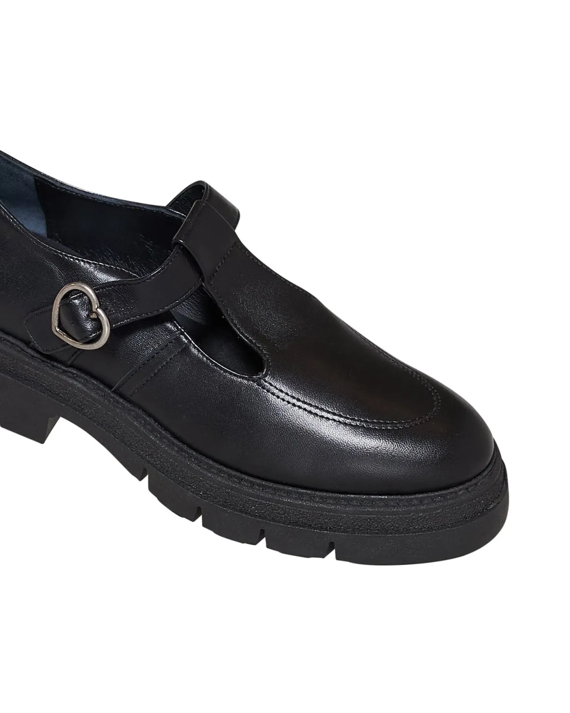 Shoe with strap and structured sole