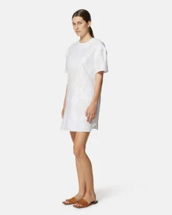 Short dress with contrasting decorative embroidery