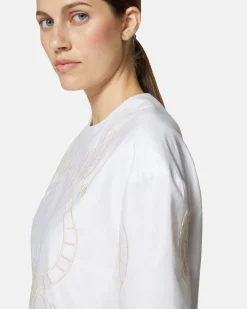 Short dress with contrasting decorative embroidery