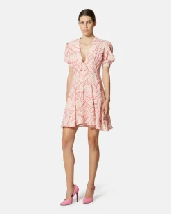 Short dress with geometric print and central bow