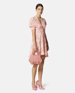 Short dress with geometric print and central bow
