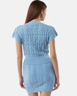 Top in shirt with studs and intertwined processing