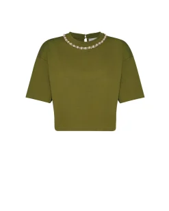Top with neckline embellished with decorative applications