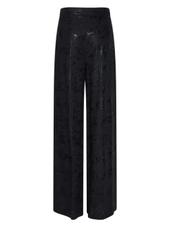 Trousers with a bright finish and fluid line