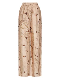 Trousers with botanical print and fluid line